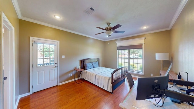 3805 Irby Dr, Conway, AR 72034 - bedroom featuring wood finished floors, multiple windows, baseboards, recessed lighting, and ornamental molding