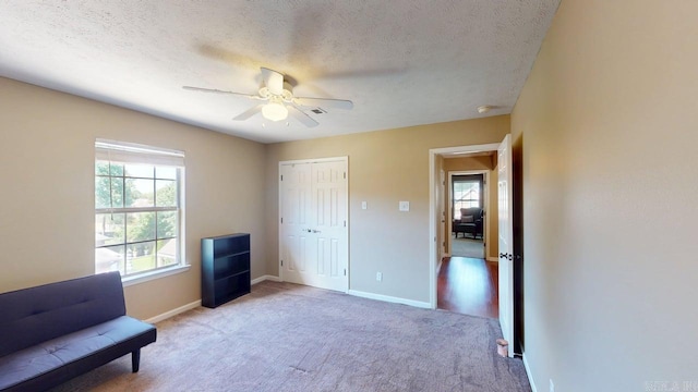 3805 Irby Dr, Conway, AR 72034 - sitting room featuring a ceiling fan, light colored carpet, baseboards, and a textured ceiling