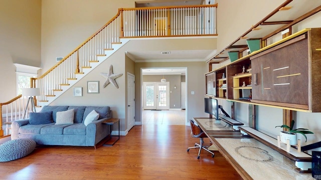 3805 Irby Dr, Conway, AR 72034 - office with light wood-type flooring, ornamental molding, a towering ceiling, and baseboards