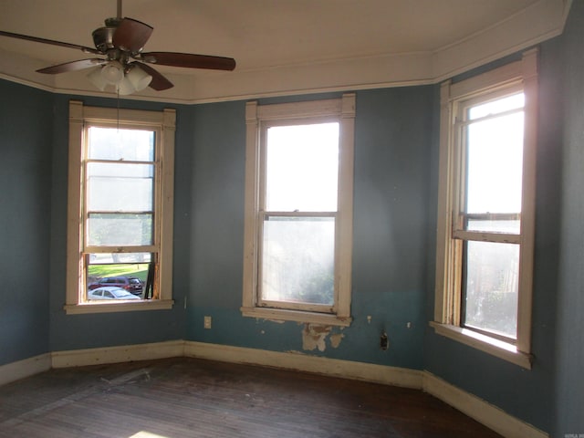 2111 S Arch St, Little Rock, AR 72206 - empty room featuring dark wood-style flooring, ceiling fan, and baseboards