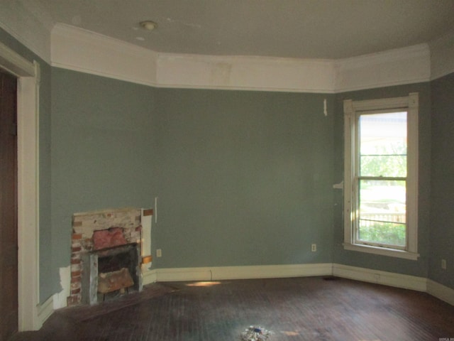 2111 S Arch St, Little Rock, AR 72206 - spare room with healthy amount of natural light, baseboards, wood finished floors, crown molding, and a fireplace