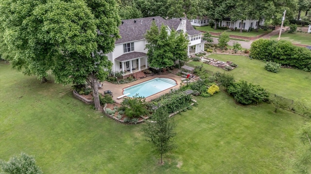 aerial view of property and surrounding area with a pool