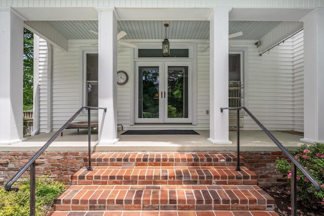 view of exterior entry with covered porch