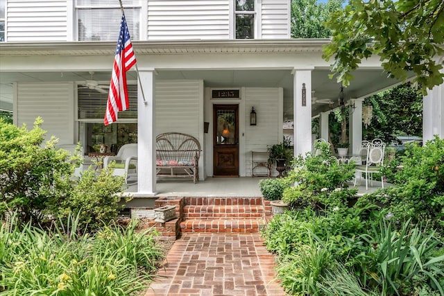 view of exterior entry featuring a porch