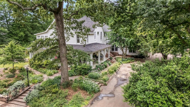 view of front of house featuring roof with shingles