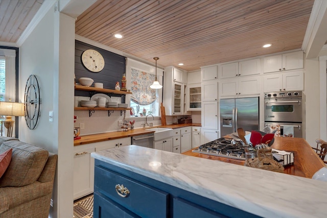 kitchen with appliances with stainless steel finishes, wooden ceiling, white cabinetry, a sink, and glass insert cabinets