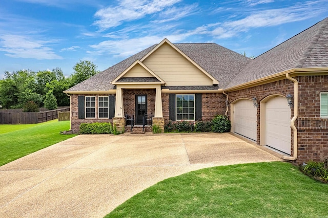 view of front facade with roof with shingles, driveway, brick siding, and an attached garage