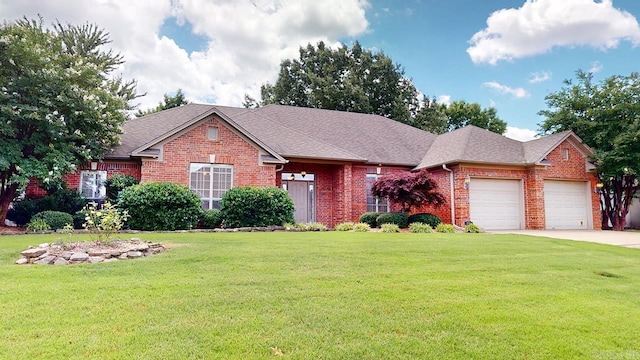 4335 Gazebo Dr, Conway, AR 72034 - view of front of home with brick siding, an attached garage, a front yard, concrete driveway, and a shingled roof