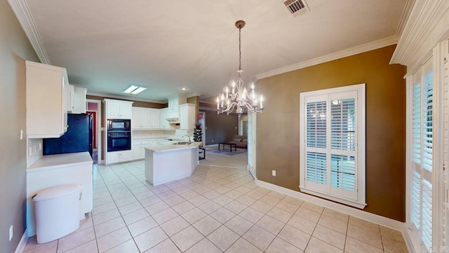 4335 Gazebo Dr, Conway, AR 72034 - kitchen with black appliances, crown molding, a chandelier, light tile patterned floors, and light countertops