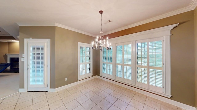 4335 Gazebo Dr, Conway, AR 72034 - unfurnished dining area with a chandelier, a fireplace, baseboards, crown molding, and light tile patterned flooring