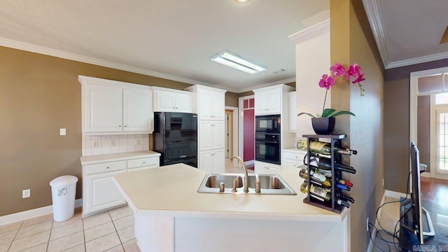 4335 Gazebo Dr, Conway, AR 72034 - kitchen featuring black appliances, a sink, ornamental molding, white cabinets, and decorative backsplash