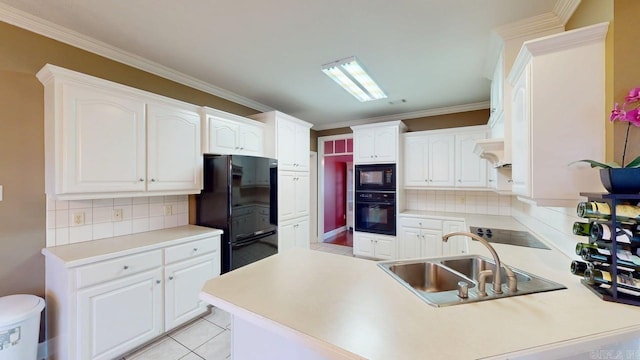 4335 Gazebo Dr, Conway, AR 72034 - kitchen featuring black appliances, a sink, a peninsula, decorative backsplash, and crown molding