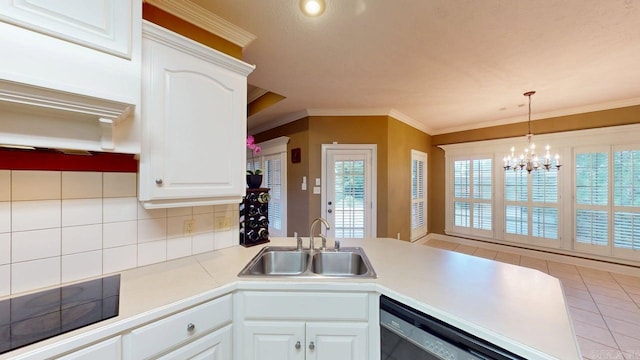 4335 Gazebo Dr, Conway, AR 72034 - kitchen featuring a sink, black appliances, a peninsula, crown molding, and white cabinetry