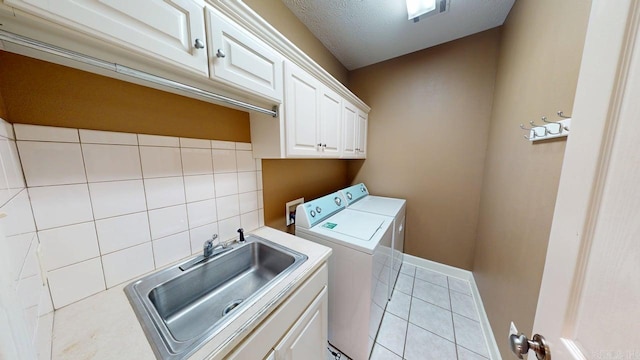 4335 Gazebo Dr, Conway, AR 72034 - laundry room with independent washer and dryer, cabinet space, light tile patterned flooring, and baseboards