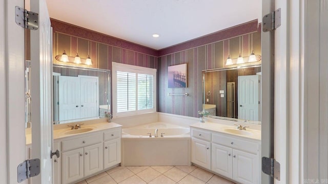 4335 Gazebo Dr, Conway, AR 72034 - full bathroom featuring two vanities, a garden tub, and tile patterned floors