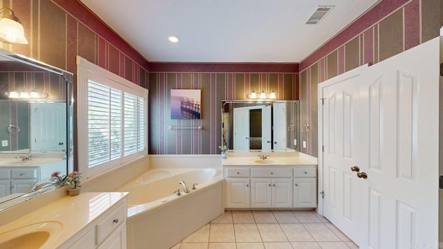 4335 Gazebo Dr, Conway, AR 72034 - bathroom featuring a bath, tile patterned floors, and two vanities