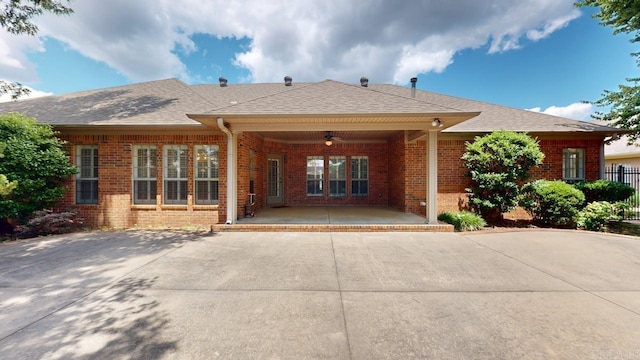 4335 Gazebo Dr, Conway, AR 72034 - rear view of house featuring brick siding, ceiling fan, a patio, and roof with shingles