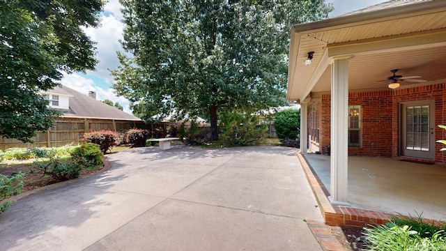 4335 Gazebo Dr, Conway, AR 72034 - fenced backyard with a ceiling fan and a patio area
