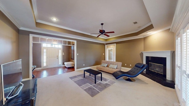 4335 Gazebo Dr, Conway, AR 72034 - living area with a tray ceiling, plenty of natural light, crown molding, baseboards, and a ceiling fan