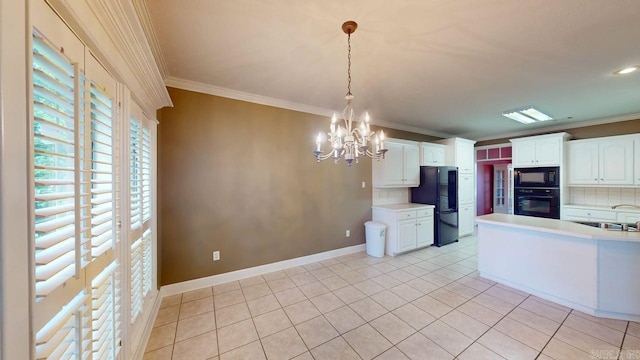 4335 Gazebo Dr, Conway, AR 72034 - kitchen featuring black appliances, crown molding, light countertops, white cabinets, and a chandelier