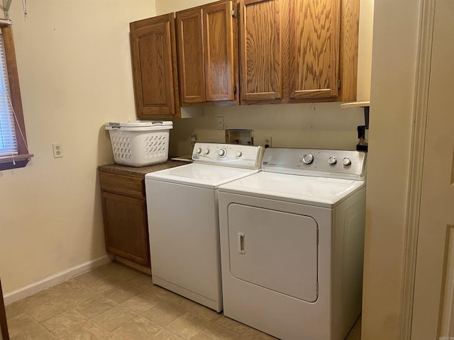 47 Eagle Ln, Mount Ida, AR 71957 - laundry area featuring cabinet space, washing machine and dryer, and baseboards