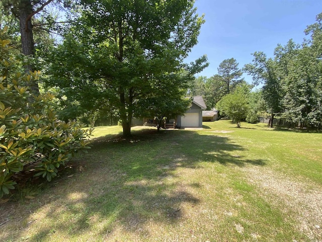 47 Eagle Ln, Mount Ida, AR 71957 - view of green lawn featuring a garage