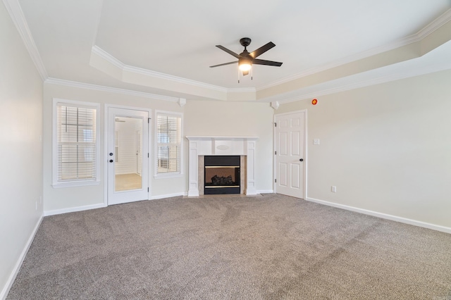 15 Alpine Ln, Cabot, AR 72023 - unfurnished living room with a raised ceiling, ceiling fan, crown molding, a fireplace, and carpet