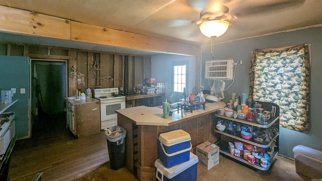 1407 Dill St, Newport, AR 72112 - kitchen featuring white electric stove, ceiling fan, and light countertops