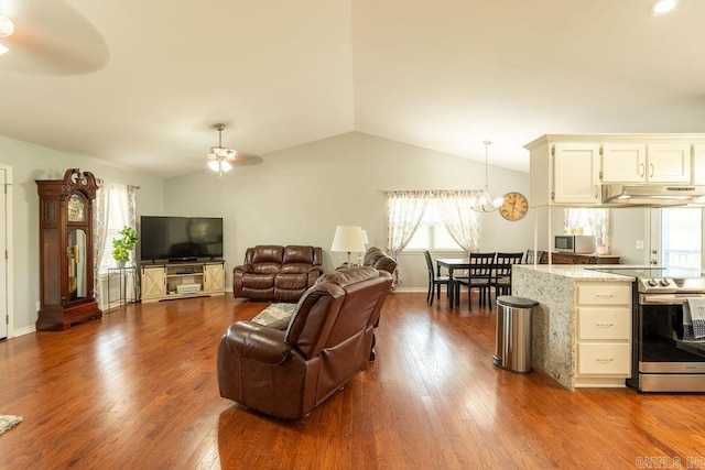 1244 N Scenic Dr, Heber Springs, AR 72543 - living room with ceiling fan, vaulted ceiling, healthy amount of natural light, dark wood-type flooring, and a chandelier