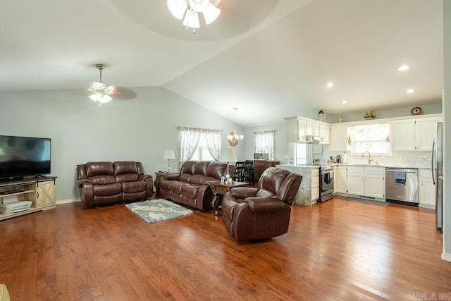 1244 N Scenic Dr, Heber Springs, AR 72543 - living room with a ceiling fan, lofted ceiling, a chandelier, wood finished floors, and recessed lighting