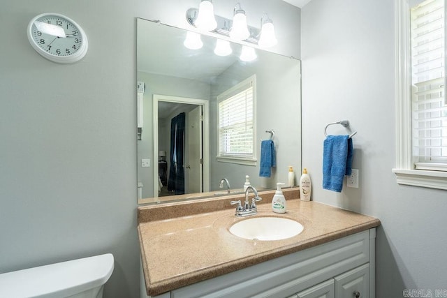 1244 N Scenic Dr, Heber Springs, AR 72543 - bathroom featuring vanity, healthy amount of natural light, and toilet