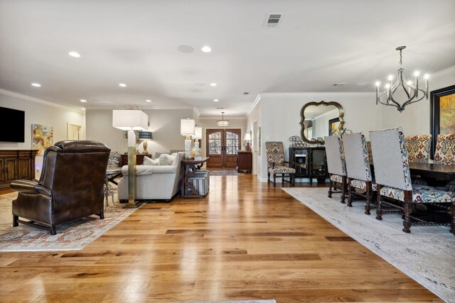 13200 Bart Moreland Dr, Roland, AR 72135 - living room with crown molding, a chandelier, light wood-style flooring, and recessed lighting