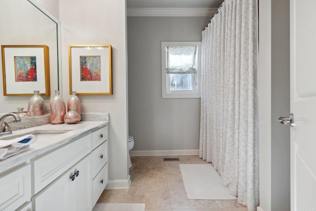 13200 Bart Moreland Dr, Roland, AR 72135 - bathroom with vanity, ornamental molding, toilet, baseboards, and tile patterned flooring