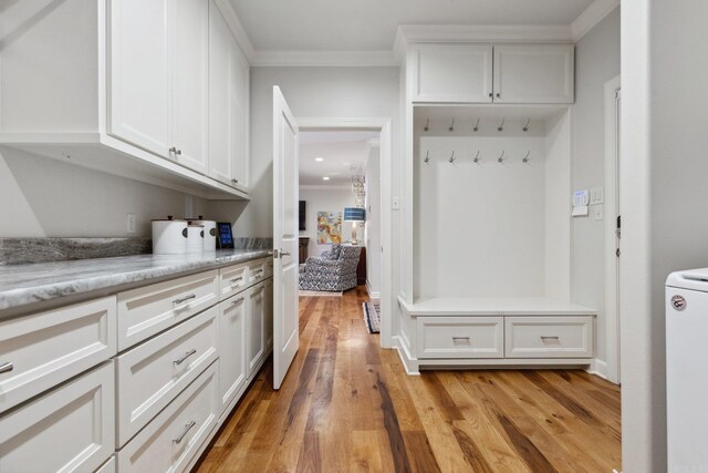 13200 Bart Moreland Dr, Roland, AR 72135 - mudroom with crown molding, light wood-style flooring, and washer / clothes dryer