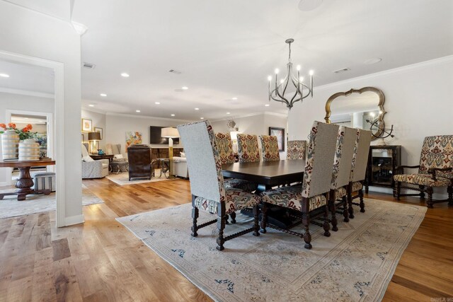 13200 Bart Moreland Dr, Roland, AR 72135 - dining room with crown molding, a chandelier, light wood-style floors, and recessed lighting