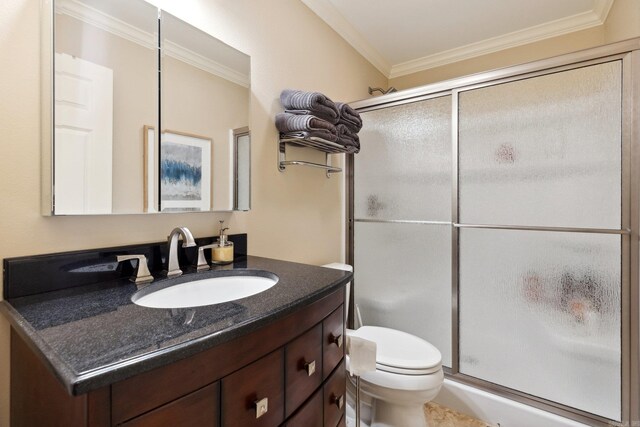 13200 Bart Moreland Dr, Roland, AR 72135 - bathroom featuring vanity, a stall shower, toilet, and ornamental molding