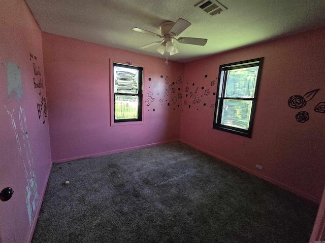 302 SW Broad St, Hoxie, AR 72433 - empty room with plenty of natural light, carpet, and ceiling fan