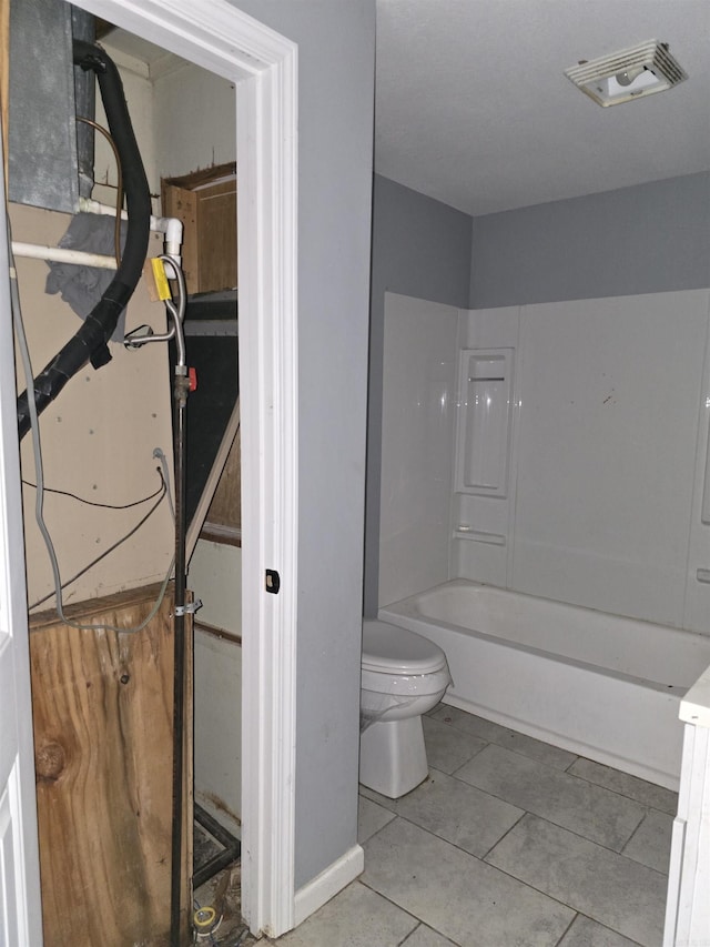302 SW Broad St, Hoxie, AR 72433 - full bath with toilet, tile patterned floors, and washtub / shower combination