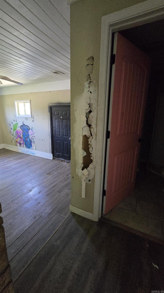302 SW Broad St, Hoxie, AR 72433 - spare room featuring dark wood-style flooring and baseboards