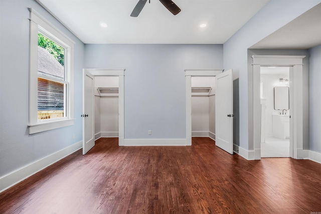 1908 S Gaines St, Little Rock, AR 72206 - unfurnished bedroom with wood finished floors, baseboards, multiple closets, a ceiling fan, and ensuite bath