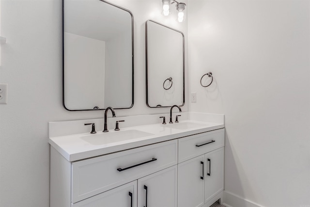 1908 S Gaines St, Little Rock, AR 72206 - bathroom with double vanity and baseboards
