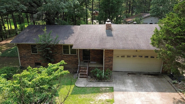 2102 N 22nd St, Paragould, AR 72450 - single story home with an attached garage, concrete driveway, brick siding, and roof with shingles