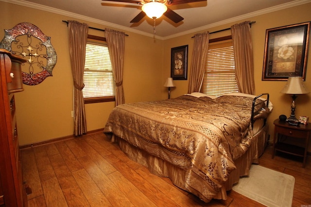 2102 N 22nd St, Paragould, AR 72450 - bedroom featuring hardwood / wood-style flooring, crown molding, baseboards, and ceiling fan
