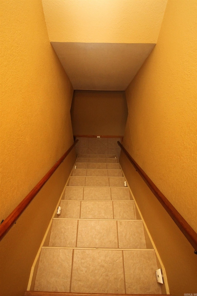 2102 N 22nd St, Paragould, AR 72450 - stairs with a textured wall and tile patterned flooring