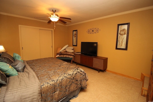2102 N 22nd St, Paragould, AR 72450 - bedroom with a closet, ornamental molding, baseboards, a ceiling fan, and light tile patterned flooring