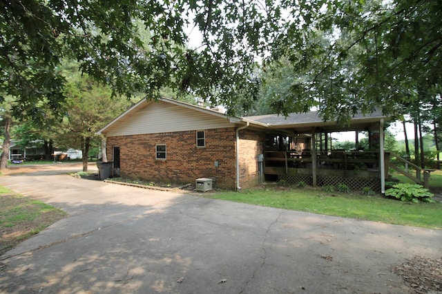2102 N 22nd St, Paragould, AR 72450 - view of property exterior with brick siding and driveway