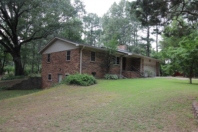 2102 N 22nd St, Paragould, AR 72450 - view of side of home with an attached garage, a chimney, a yard, and brick siding