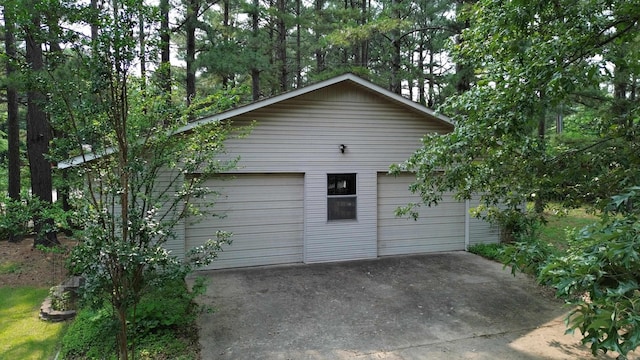 2102 N 22nd St, Paragould, AR 72450 - view of side of home with a garage and an outdoor structure