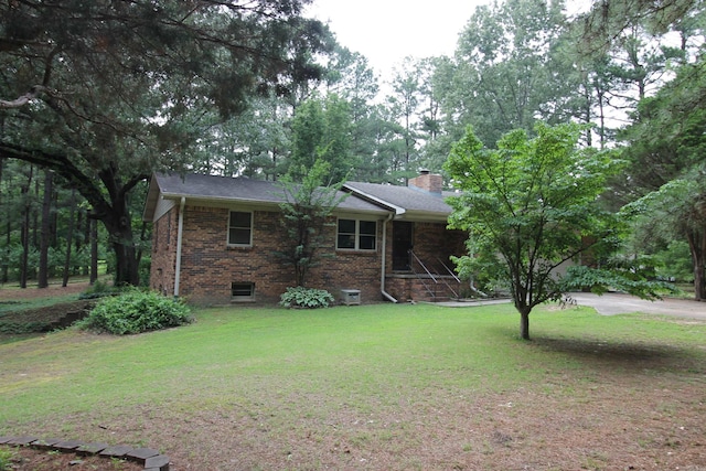 2102 N 22nd St, Paragould, AR 72450 - single story home with a chimney, a front lawn, and brick siding