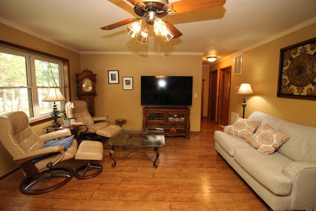 2102 N 22nd St, Paragould, AR 72450 - living area with hardwood / wood-style flooring, ceiling fan, and ornamental molding